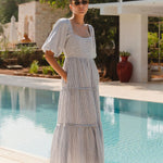 model wears a blue white stripe maxi dress