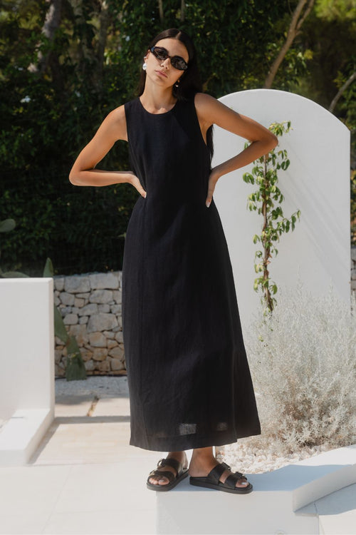 model wearing long black linen dress
