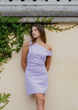 model wears a Purple Off Shoulder Mini Dress