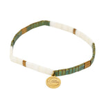Necklace with green and gold accents on a white background