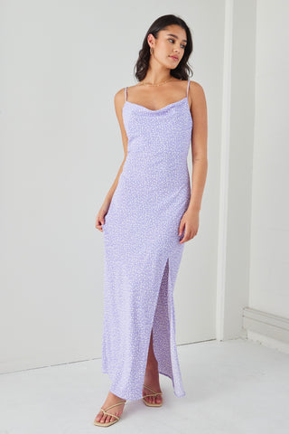 Model wears a lilac floral dress