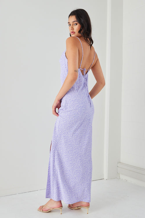 Model wears a lilac floral dress