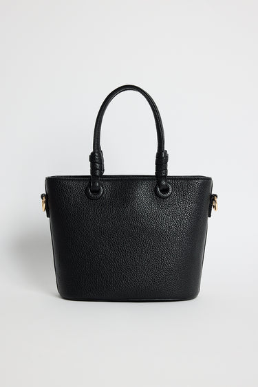 Small black PU leather handbag with knotted top handles and a long detachable shoulder strap, photographed against a plain light background