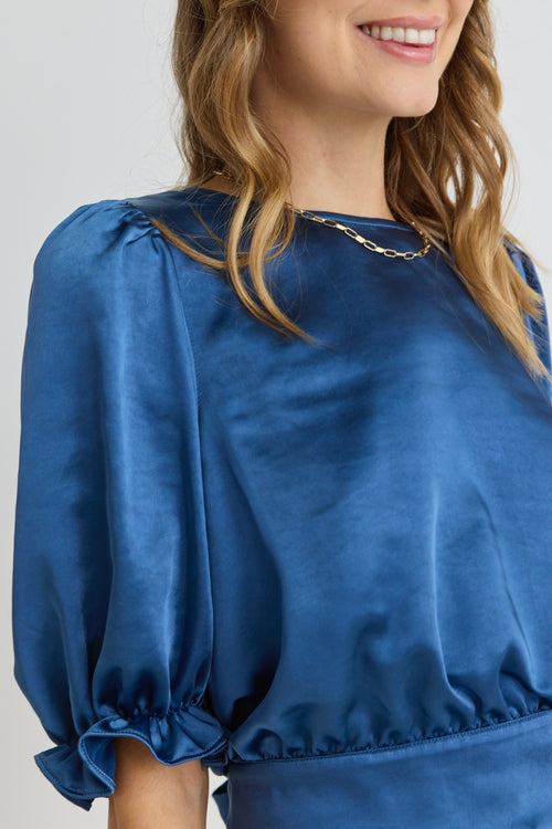 model wears Blue Satin Short Sleeve Top