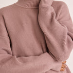 model wears a pink knit