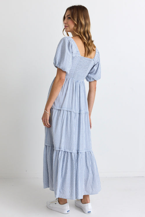 model wears a blue white stripe maxi dress