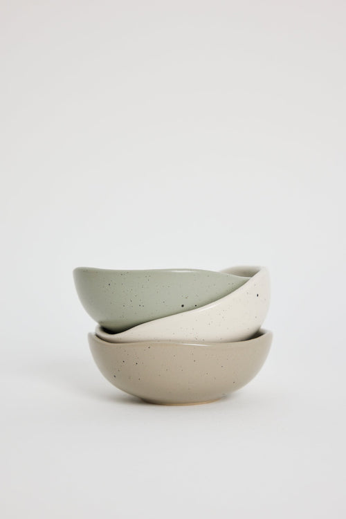 Two ceramic bowls stacked on a white background