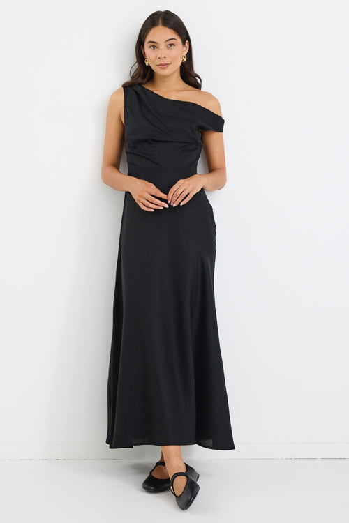 model wears an off the shoulder black linen maxi dress
