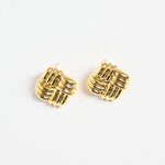 gold-plated brass stud earrings with an interwoven square design, photographed flat on a white background.