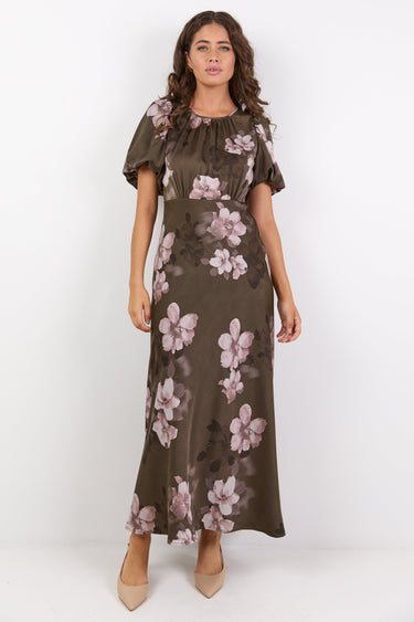 Woman wearing a floral dress on a white background