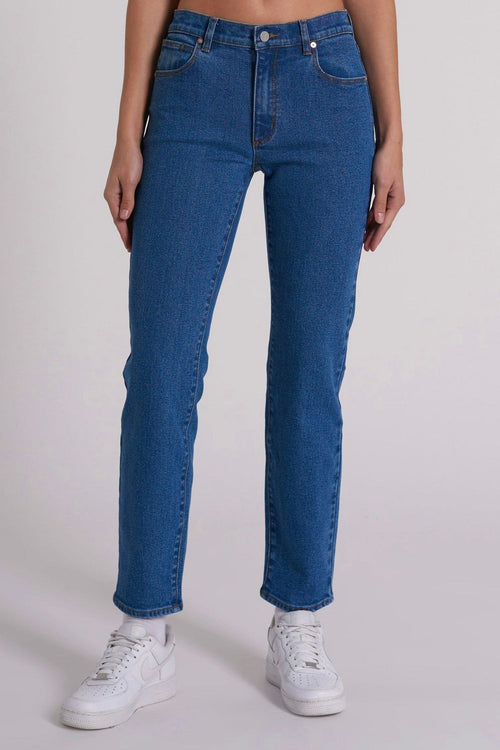 model wears blue denim jeans