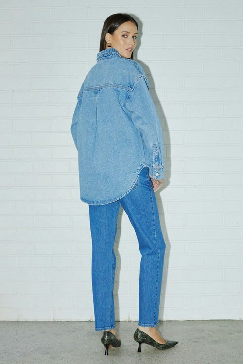 model wears blue denim jeans
