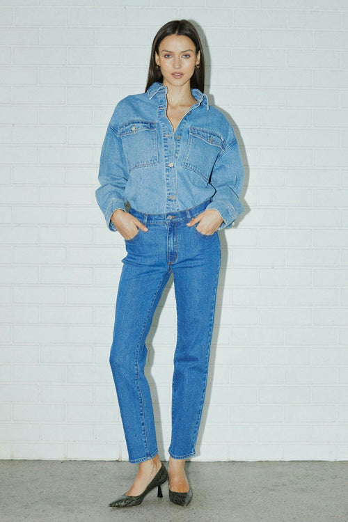 model wears blue denim jeans