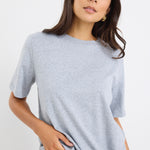 model wears a grey t-shirt