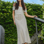 model wears a natural linen skirt