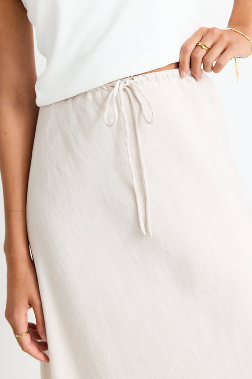 model wears a natural linen skirt