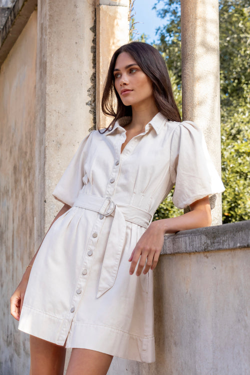 model wears a ecru mini denim dress 