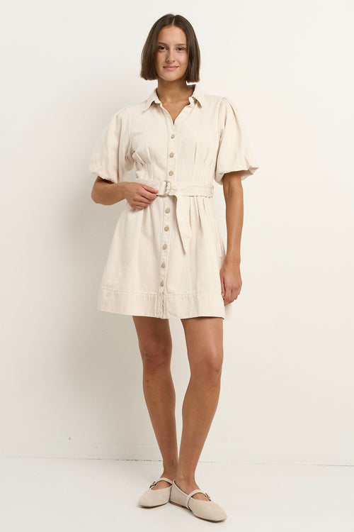 model wears a ecru mini denim dress 