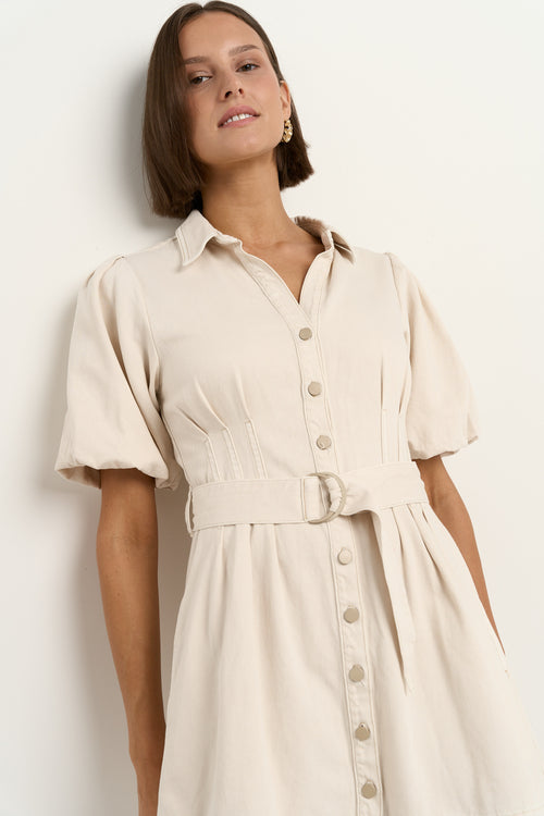 model wears a ecru mini denim dress 