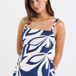Strapless navy and white floral print cami top with side cut-out details and a flattering silhouette.