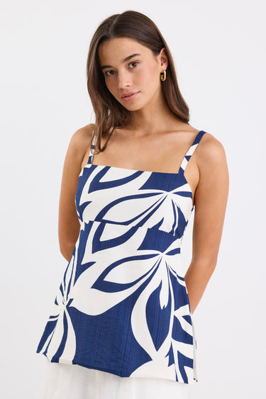 Strapless navy and white floral print cami top with side cut-out details and a flattering silhouette.