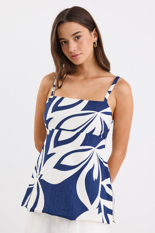 Strapless navy and white floral print cami top with side cut-out details and a flattering silhouette.