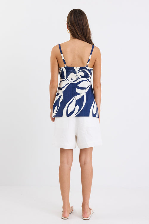 Strapless navy and white floral print cami top with side cut-out details and a flattering silhouette.