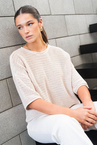 model wears a Beige Crochet Knit Top