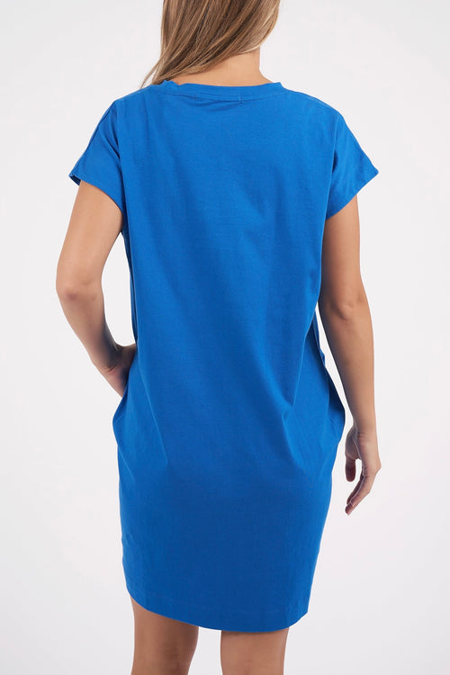 model wears a blue t shirt dress 