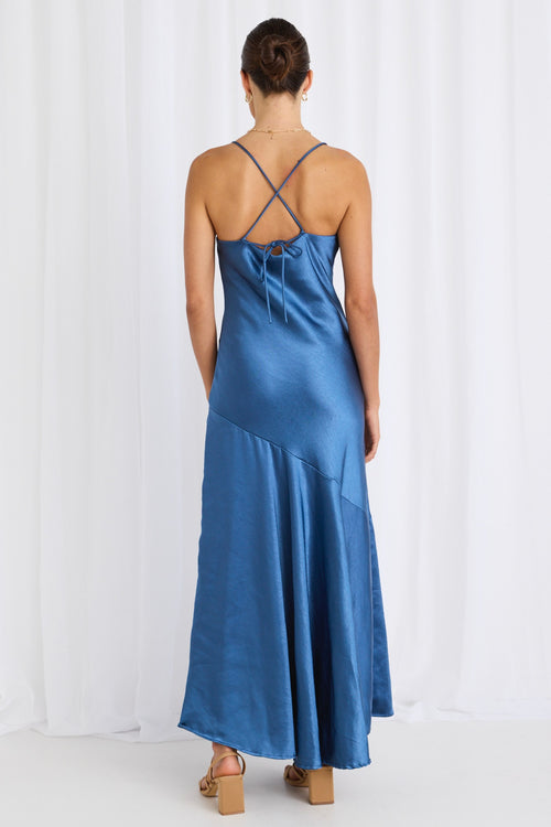 model wears a blue satin maxi dress