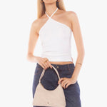 Beige faux suede shoulder bag with a minimalist design and single strap handle.