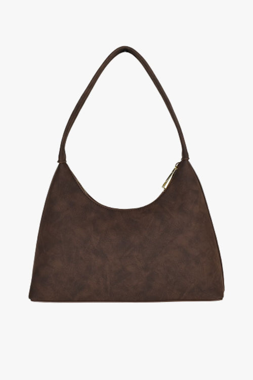 Chocolate brown faux suede shoulder bag with a single strap, crescent silhouette, and gold zip closure, displayed front-facing on a white background.