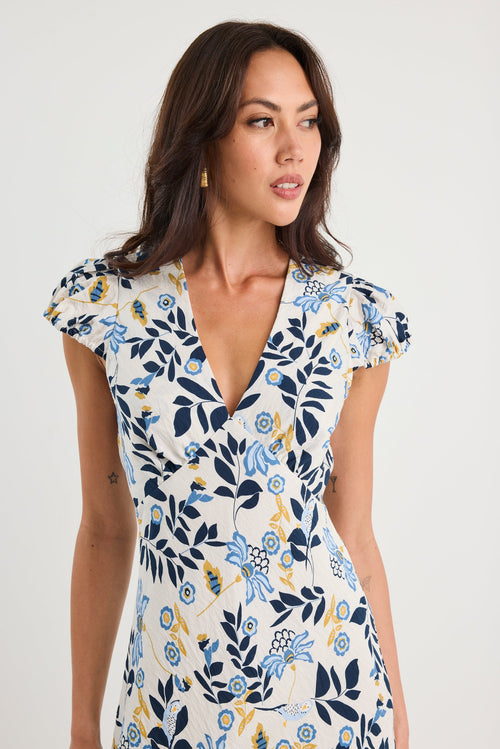Woman wearing a floral dress on a white background