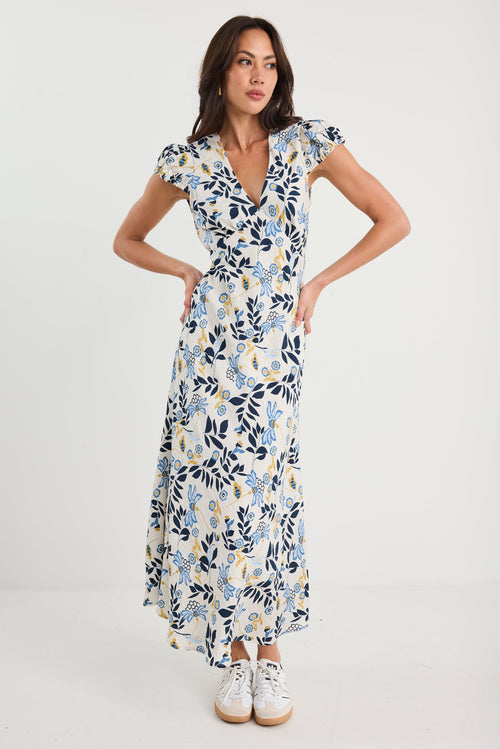 Woman wearing a floral dress on a white background