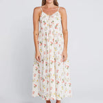 Woman wearing a floral cream long dress