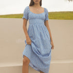 model wears a blue spot maxi dress