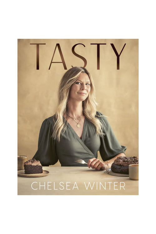 Book cover of 'Tasty' by Chelsea Winter featuring a woman at a table with cakes.