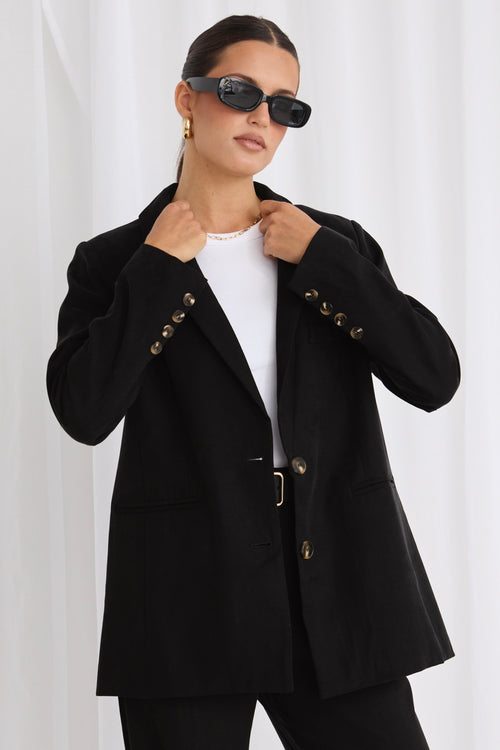 model wears a black blazer 