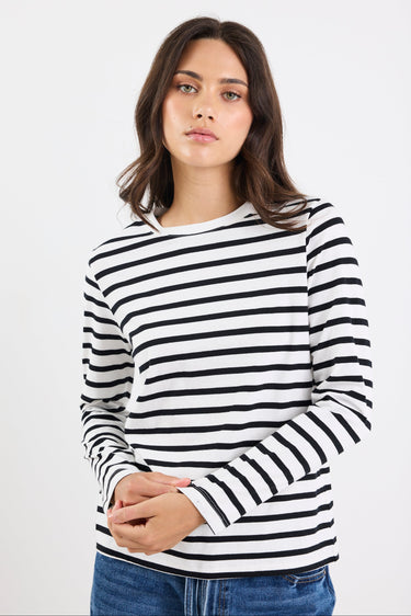 Woman wearing a black and white striped long-sleeve shirt on a white background