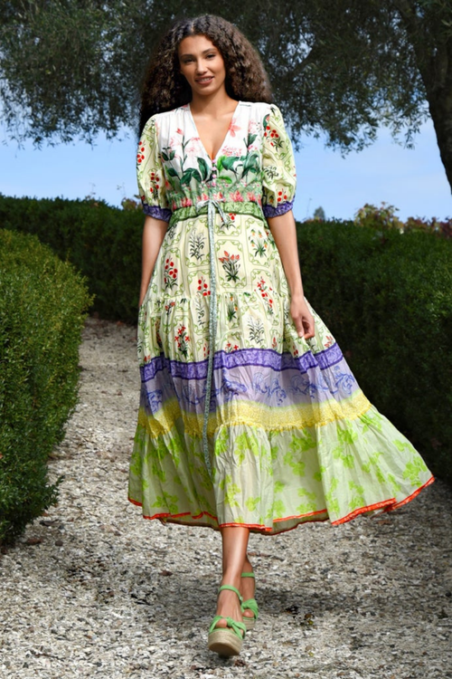 model wears green floral midi dress