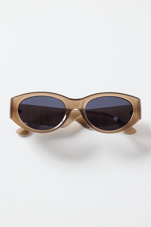 Espresso-brown cat-eye sunglasses with dark tinted lenses, photographed on a white background