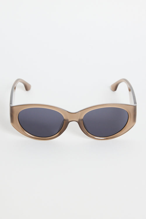 Espresso-brown cat-eye sunglasses with dark tinted lenses, photographed on a white background