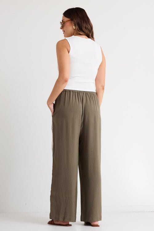 model wears a green wide leg pant