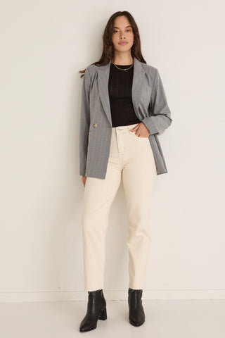 model wears a grey blazer