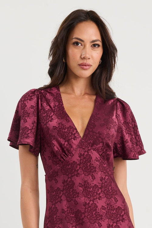 Shop Tram Burgundy Jacquard Bias Flared Maxi Dress | Flo & Frankie Shop Tram Burgundy Jacquard Bias Flared Maxi Dress | Flo & Frankie