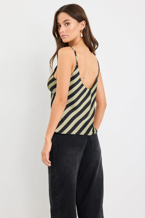 Woman wearing a khaki and black diagonal stripe satin cami with thin straps and a bias-cut silhouette.
col_pattern