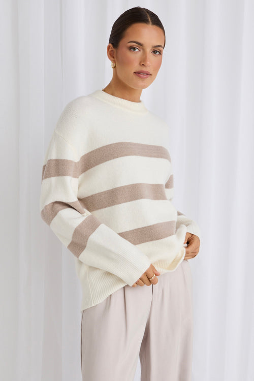 model wears a white stripe knit 