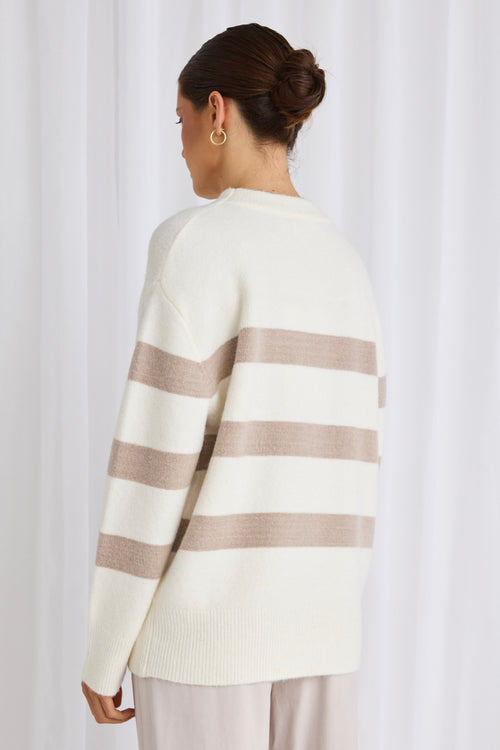 model wears a white stripe knit 