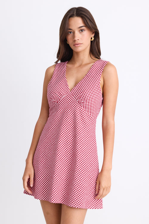 A sleeveless red and white gingham mini dress with a flattering V-neckline. Fully lined for comfort, made from 100% Cotton for a breathable, natural feel.