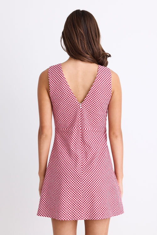 A sleeveless red and white gingham mini dress with a flattering V-neckline. Fully lined for comfort, made from 100% Cotton for a breathable, natural feel.